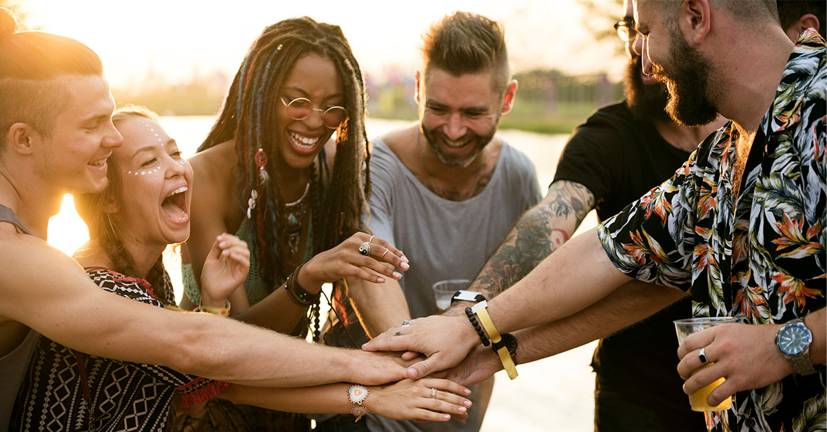 Group of friends, hands in the middle community